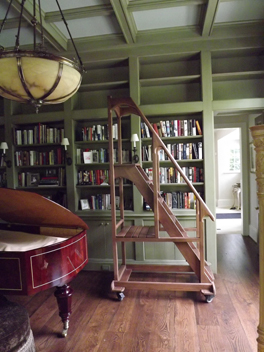 Custom designed and built mahogany Library Rolling Staircase